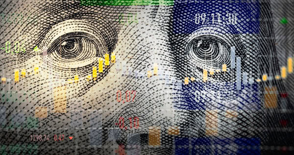 Close-up of Benjamin Franklin’s face on a U.S. $100 bill overlaid with colorful stock market charts and graphs.
