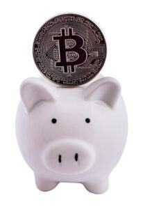 Bitcoin coin and a piggy bank, isolated on white