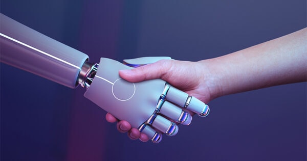 A human hand shakes hands with a robotic hand against a purple gradient background, symbolizing collaboration between humans and technology.