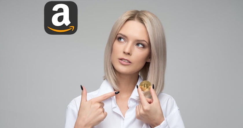 A woman in a white shirt holds a Bitcoin coin and points at it, with an Amazon logo displayed in the top left corner against a gray background.