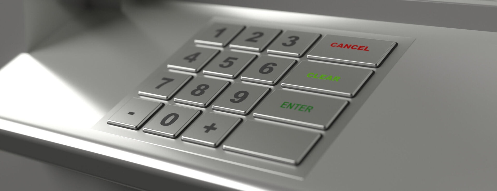 Close-up of a metallic keypad with numbers 0 to 9 and three labeled buttons: CANCEL in red, CLEAR in green, and ENTER in green. The keys are raised and the keypad is set into a silver surface.