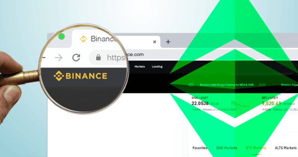 A magnifying glass focuses on the Binance logo in a web browser, with green digital graphics overlaying part of the image.