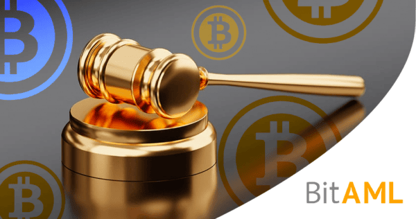 A golden gavel rests on a sound block with Bitcoin symbols in the background and the text 