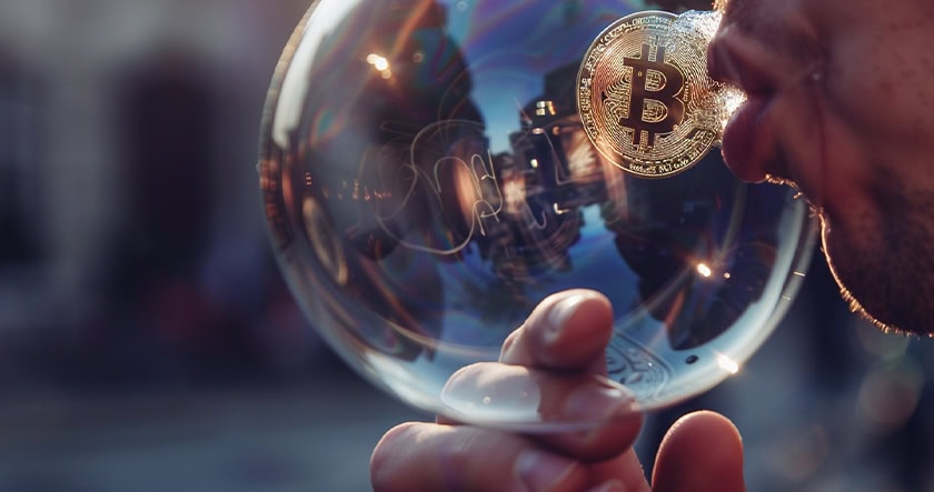 A person blows a large transparent bubble with a Bitcoin logo inside, reflecting buildings in the background.