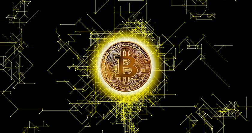A gold Bitcoin coin is shown at the center with a glowing effect, surrounded by yellow digital circuit lines on a black background.