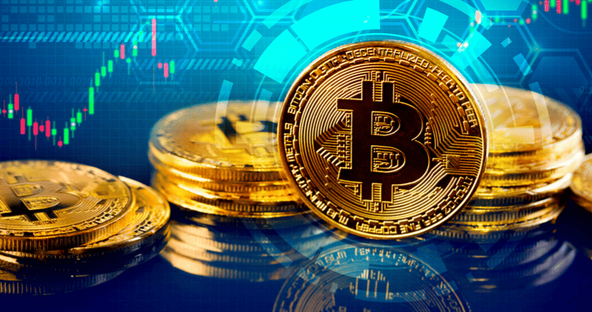 Stacks of gold-colored Bitcoin tokens are displayed in front of a digital background featuring a price chart and abstract technological graphics.