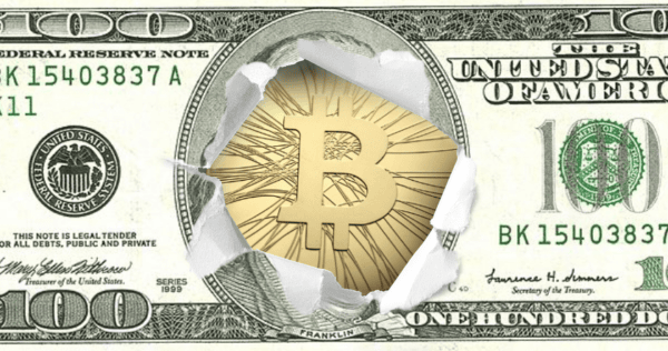 A gold Bitcoin symbol appears through a torn hole in the center of a US one hundred dollar bill.