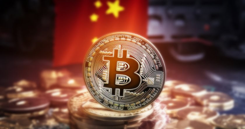 A Bitcoin coin is displayed in front of a blurred Chinese flag, with more coins scattered around the base.