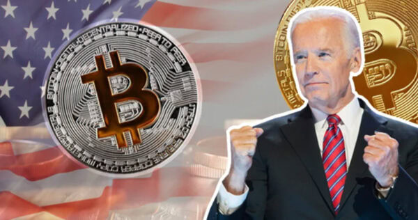 A man in a suit stands with clenched fists in front of an American flag backdrop, with large Bitcoin symbols superimposed beside him.