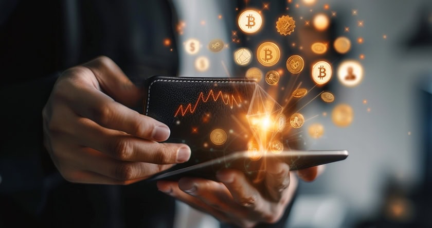 A person holding a smartphone with digital wallets, displaying floating cryptocurrency symbols including Bitcoin and data graphics.