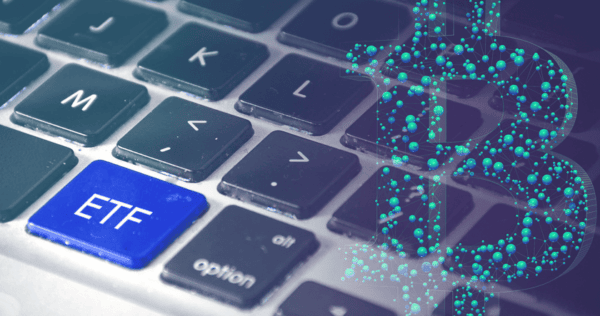 A close-up of a computer keyboard with a blue key labeled 