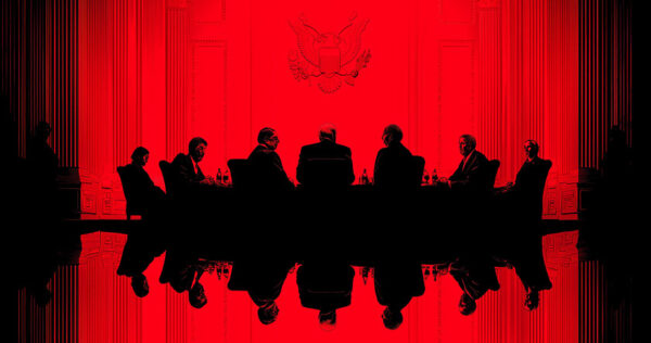 Silhouettes of seven people sit around a table in a formal room with a red background and an emblem on the wall.
