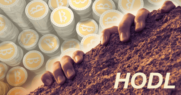 Two hands grip soil in the foreground with stacks of Bitcoin coins in the background, and the word 