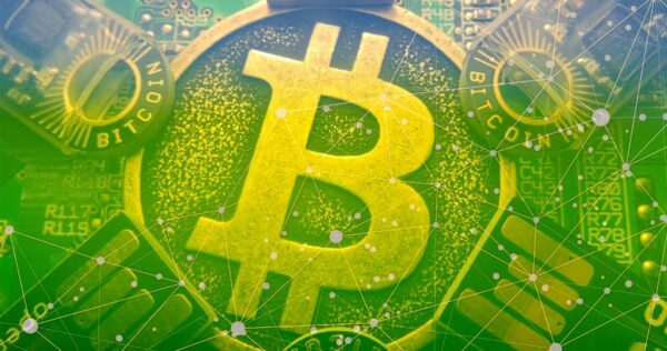 A close-up of a gold Bitcoin symbol on a circuit board with a digital network pattern overlay.