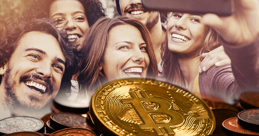 A group of smiling people take a selfie, with a large image of a Bitcoin coin and other coins overlaid in the foreground.