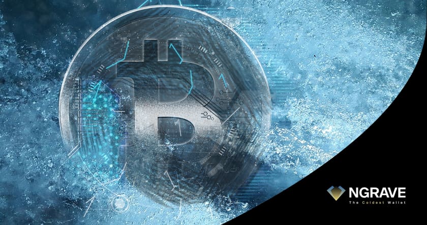 Metallic Bitcoin symbol surrounded by icy, blue digital effects, with the NGRAVE logo and slogan "The Coldest Wallet" in the bottom right corner.