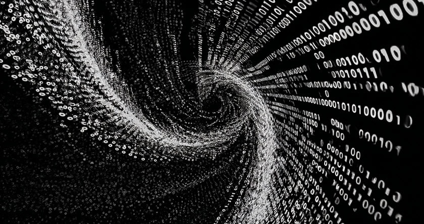 A swirling vortex of white binary code (ones and zeros) on a black background, creating a digital, abstract tunnel effect.