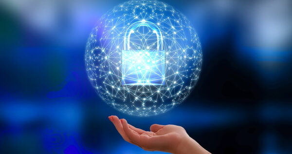 A hand is held up under a glowing digital sphere containing a padlock, symbolizing cybersecurity and data protection on a blue background.