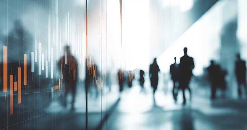 Blurry silhouettes of people walk through a modern glass building; a digital graph with bar and line data overlays the left side of the image.