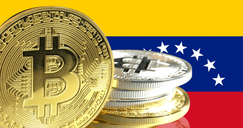 Stacks of Bitcoin coins are displayed in front of the Venezuelan flag.
