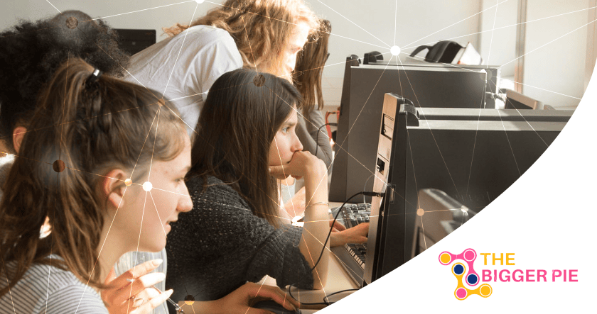 Several women sit at computers, focusing on their screens in a bright office setting. The Bigger Pie logo is visible in the bottom right corner.